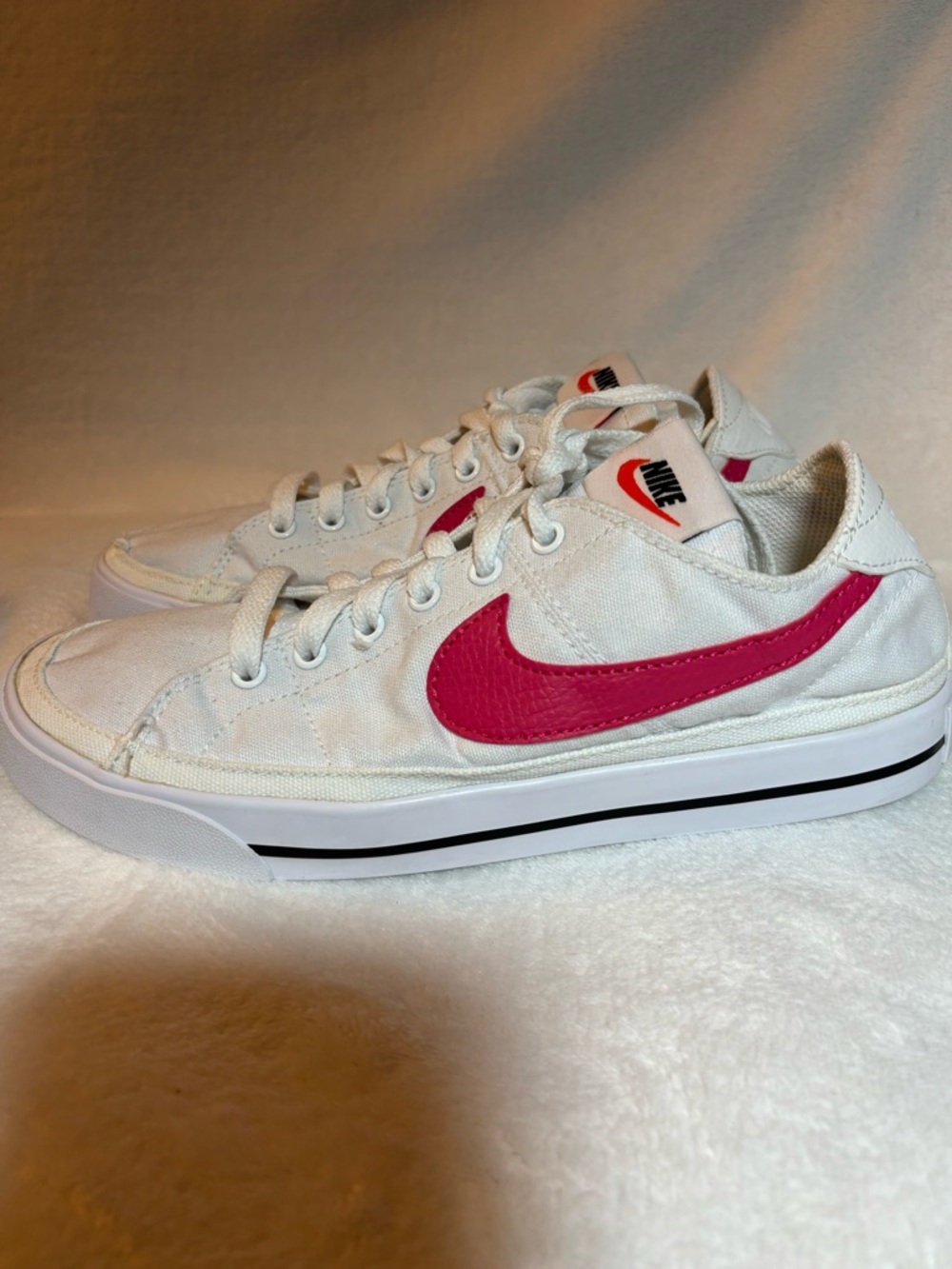 Nike Women's White Sneakers with Pink Swoosh